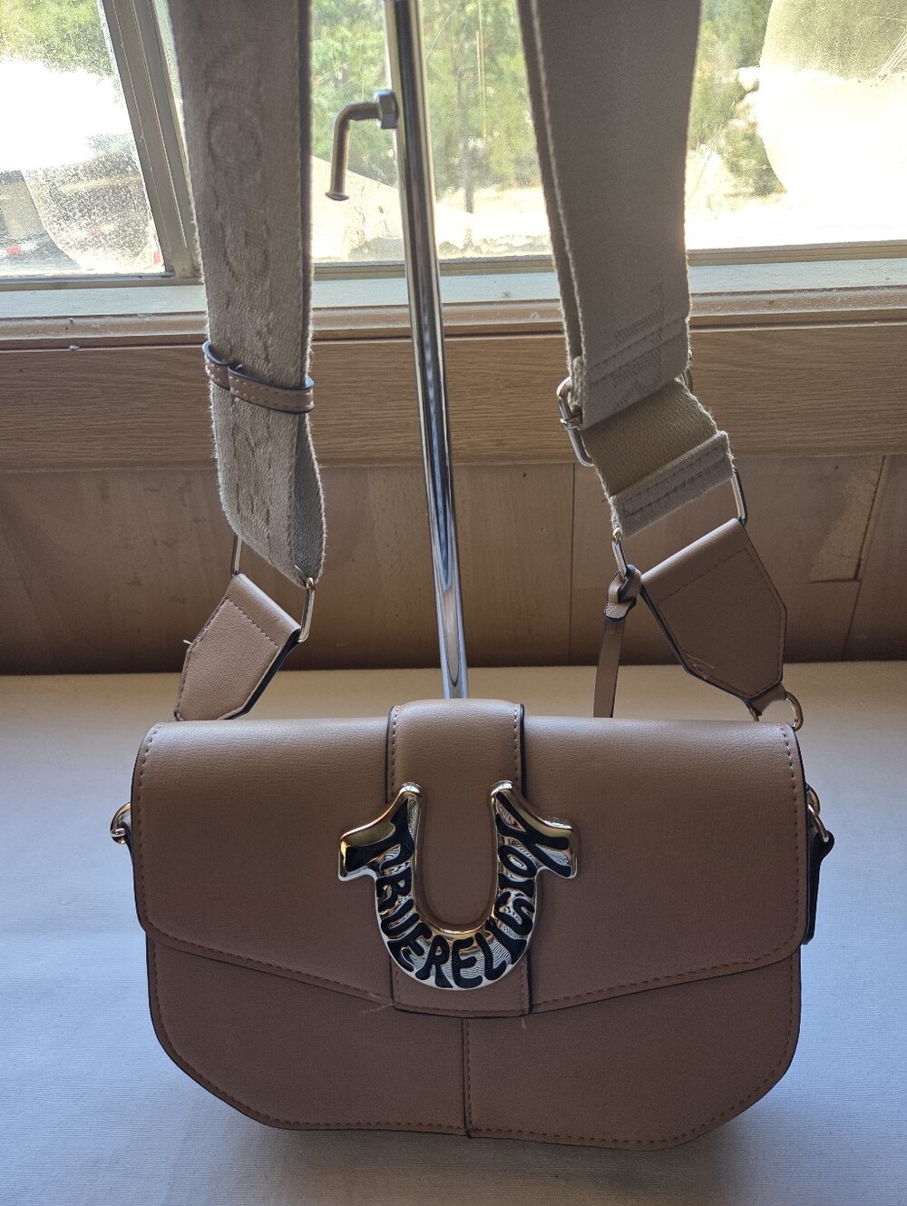 Women’s Crossbody Saddle Bag in Taupe with Embellished Hardware